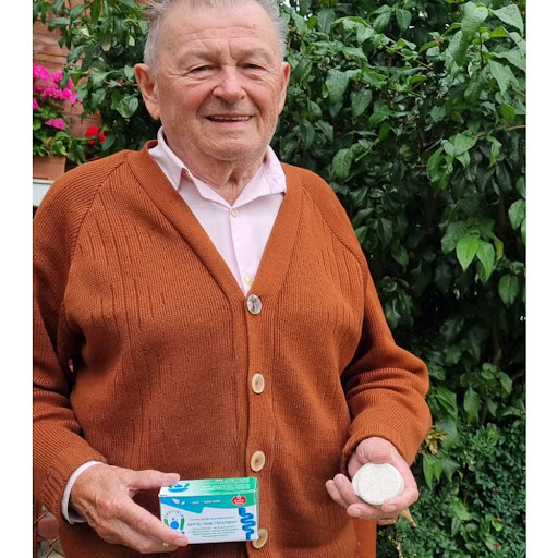 Michael P. holding Septifix box in garden